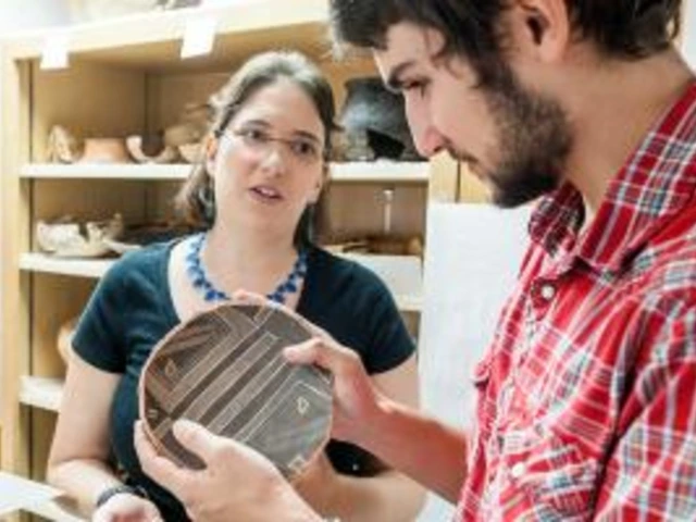 Anthropologists looking at an artifact.