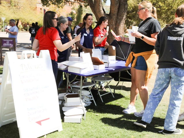 SBS staff and community members conversing outside.