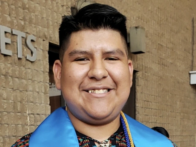 Student stands outside a brick building, wearing graduation regalia