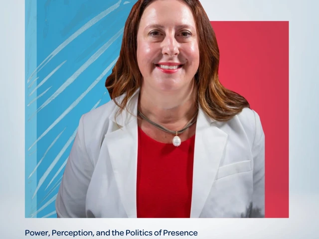 Dean Lori Poloni-Staudinger stands in a red shirt and white jacket in front of a red, white and blue graphic background