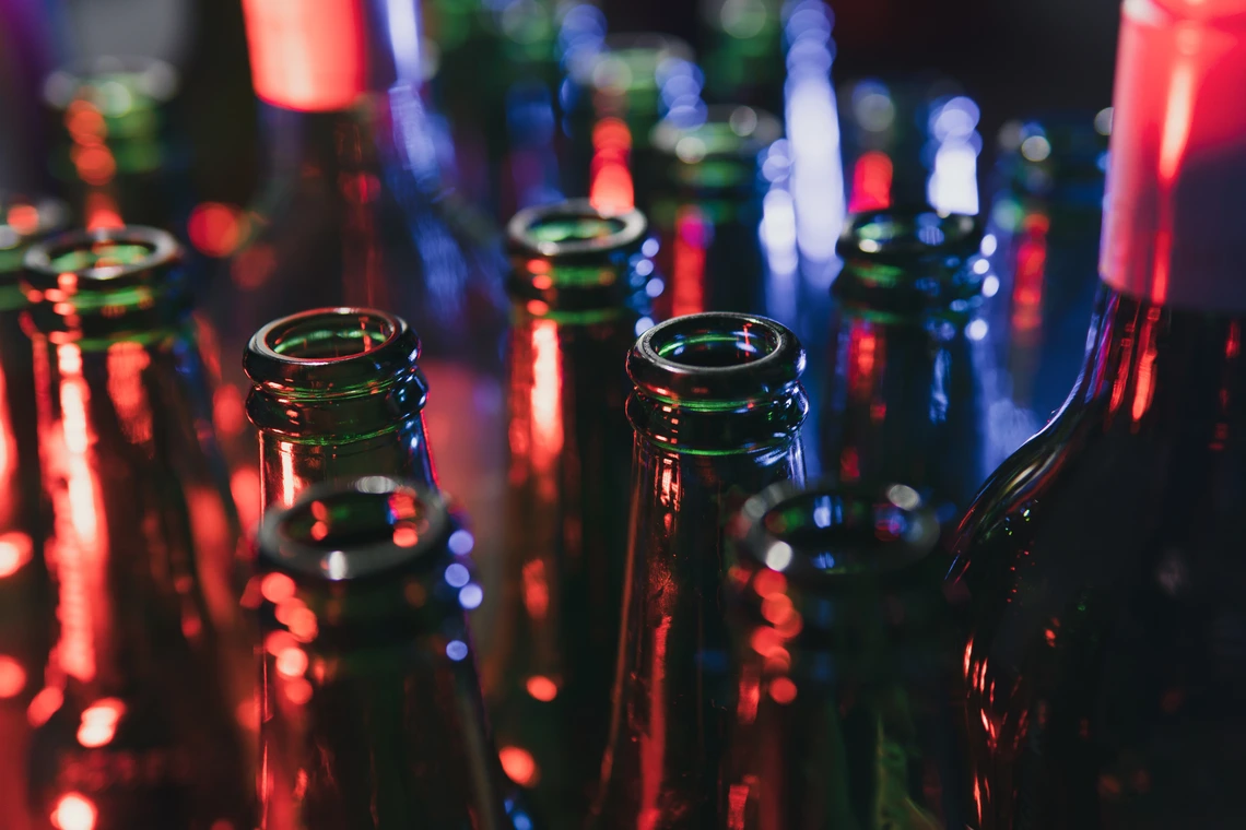A brightly colored photo of the tops of bottles