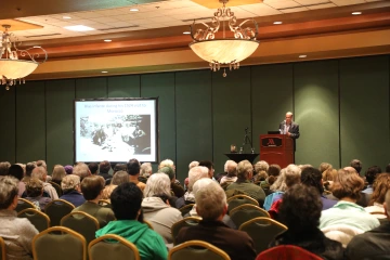 speaker and audience and large screen
