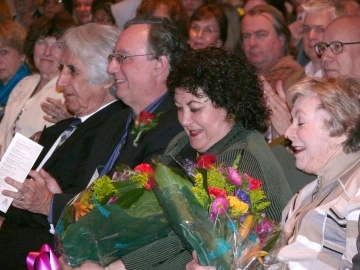 Vivi presented with flowers at the Sabbagh Lecture. To her left is the late Selma Paul Marks. To her right is Professor Juan R.I. Cole, who spoke in  2006 and 2012.