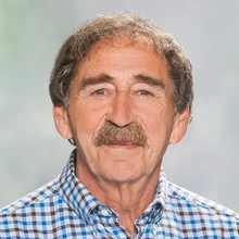 Man with light brown hair and mustache